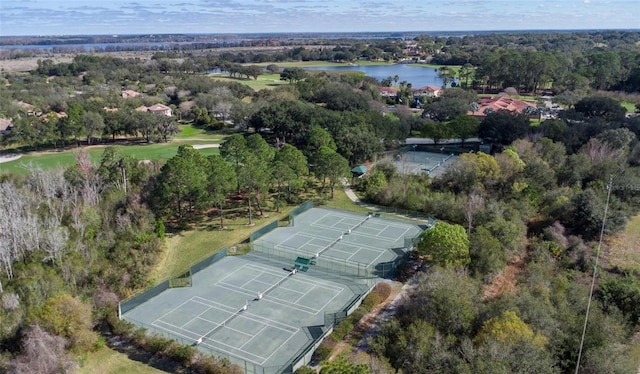 drone / aerial view featuring a water view and a forest view