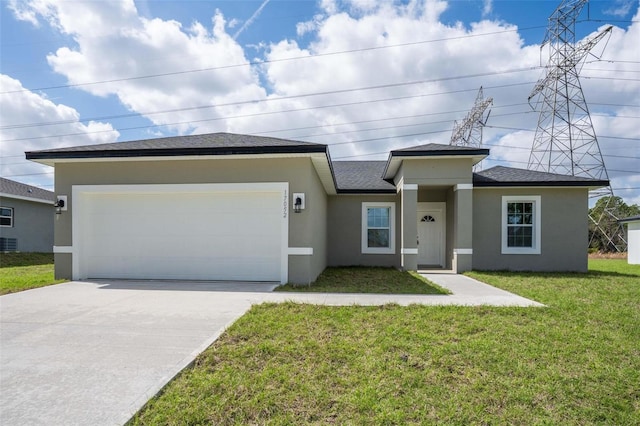 prairie-style house featuring stucco siding, concrete driveway, an attached garage, a front yard, and cooling unit