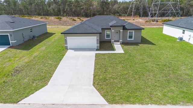 ranch-style home with an attached garage, a front lawn, concrete driveway, and stucco siding