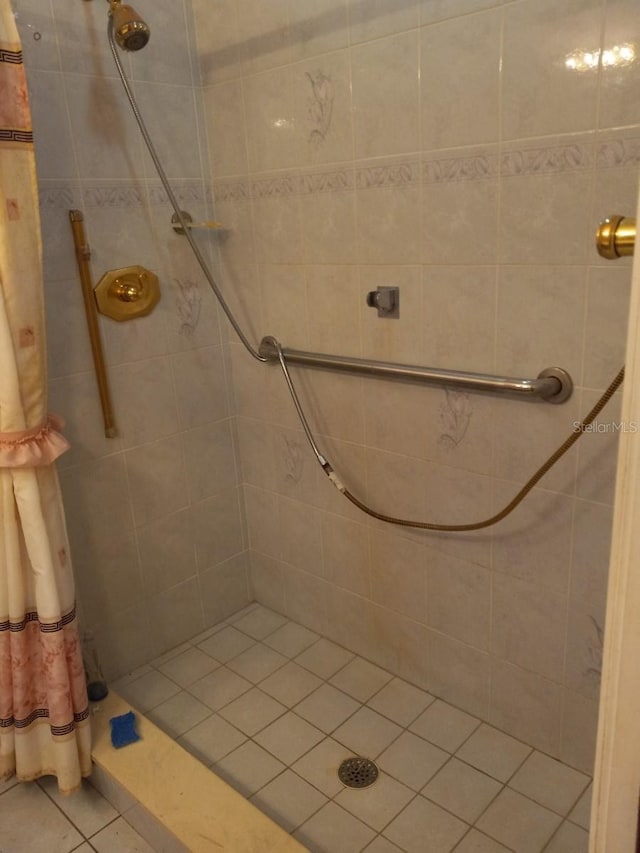 full bath with a tile shower