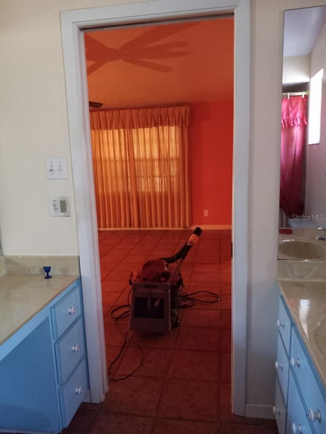 full bathroom featuring tile patterned flooring, vanity, and baseboards