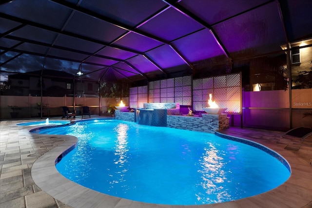 view of pool featuring a lanai and a patio area