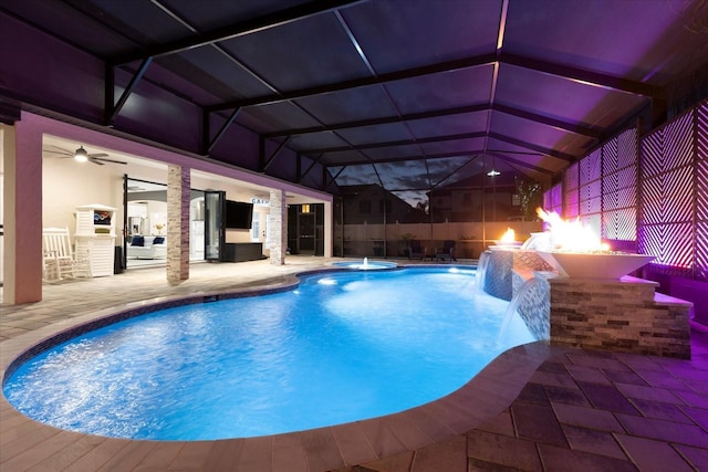 view of pool featuring a lanai, a patio area, a pool with connected hot tub, and outdoor dry bar