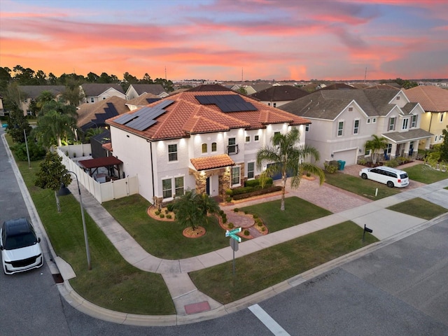 aerial view at dusk with a residential view