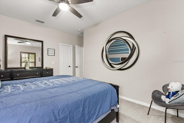 bedroom featuring a ceiling fan, carpet flooring, visible vents, and baseboards