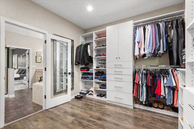 spacious closet featuring wood finished floors