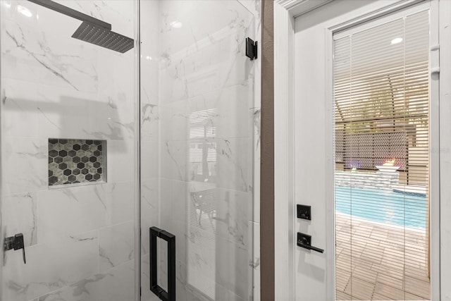 full bathroom with a marble finish shower