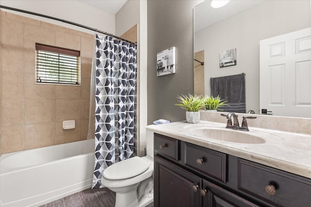 bathroom featuring shower / tub combo with curtain, vanity, toilet, and wood finished floors