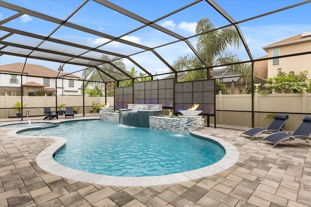 view of pool with a fenced in pool, glass enclosure, a patio area, and fence