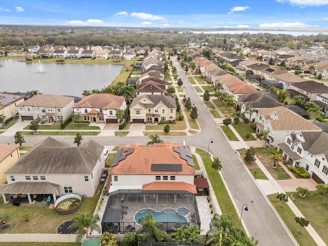 bird's eye view with a residential view and a water view