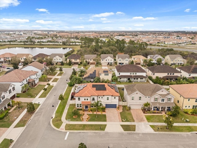 aerial view with a water view and a residential view