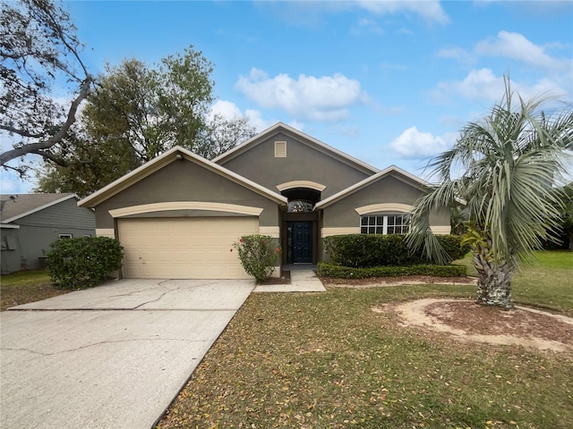 ranch-style home with driveway, an attached garage, and stucco siding