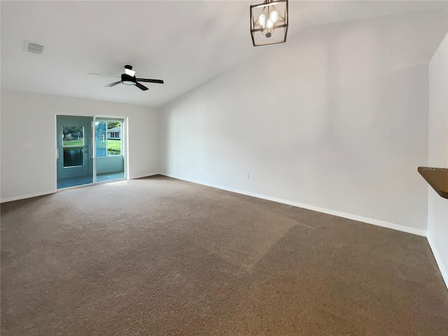 unfurnished room featuring carpet floors, visible vents, baseboards, and ceiling fan with notable chandelier