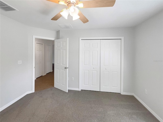 unfurnished bedroom featuring a closet, visible vents, carpet flooring, ceiling fan, and baseboards