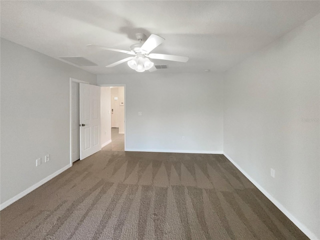 empty room featuring carpet, baseboards, and ceiling fan