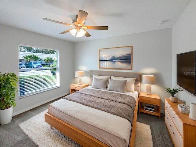 bedroom with carpet, ceiling fan, and baseboards