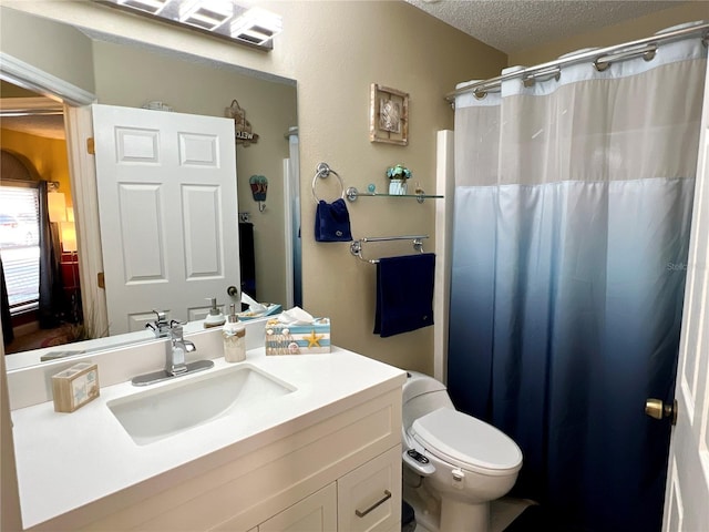 bathroom with toilet, a textured ceiling, a shower with shower curtain, and vanity