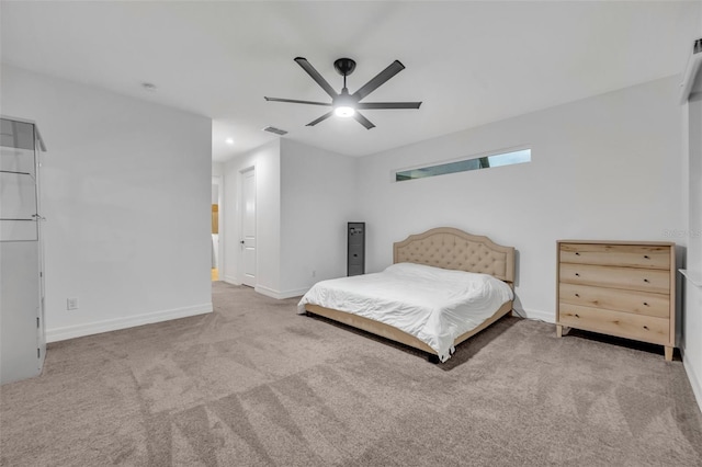 unfurnished bedroom featuring a ceiling fan, carpet, visible vents, and baseboards