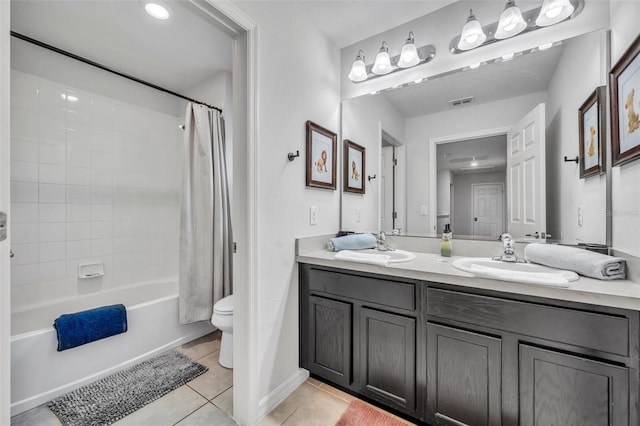 full bathroom featuring toilet, shower / bath combo, a sink, tile patterned flooring, and double vanity