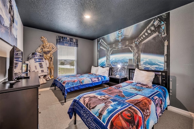 bedroom featuring carpet flooring, baseboards, and a textured ceiling