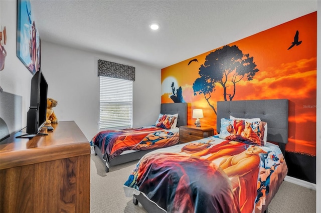 bedroom featuring a textured ceiling, baseboards, and carpet floors