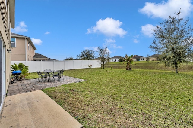 view of yard with a patio and fence