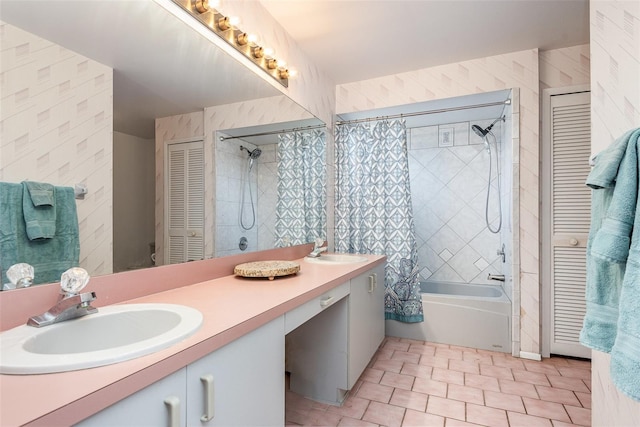 full bathroom with double vanity, a closet, shower / bath combo, and a sink