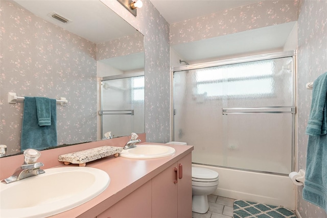 full bathroom featuring a sink and wallpapered walls