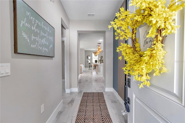 12639 SW 78th Pl, Dunnellon, FL 34432 - corridor with a textured ceiling and baseboards