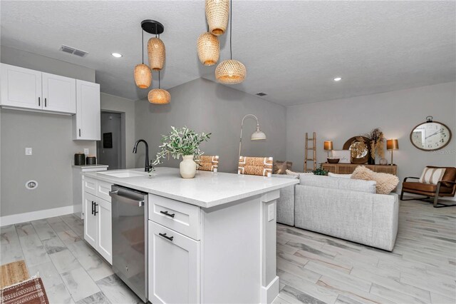 12639 SW 78th Pl, Dunnellon, FL 34432 - kitchen with stainless steel dishwasher, a sink, recessed lighting, white cabinetry, and light countertops