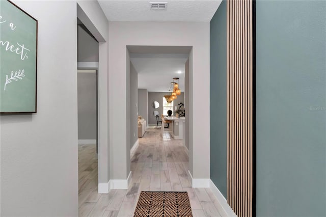 12639 SW 78th Pl, Dunnellon, FL 34432 - corridor featuring baseboards and light wood-style flooring