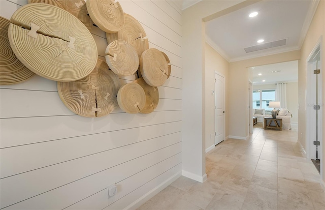 corridor with recessed lighting, crown molding, and baseboards