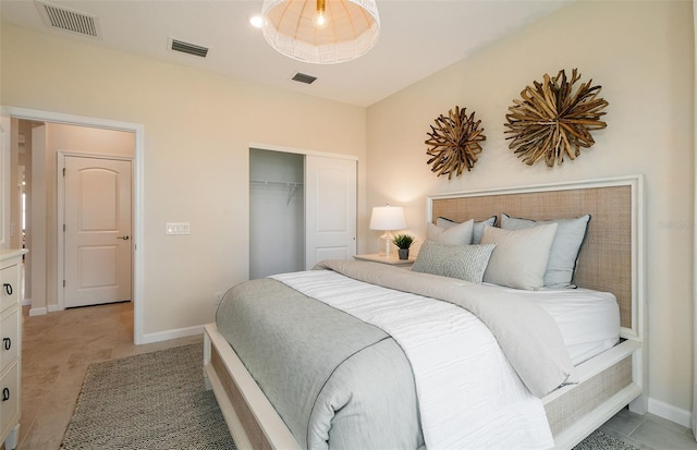 bedroom featuring a closet, visible vents, and baseboards