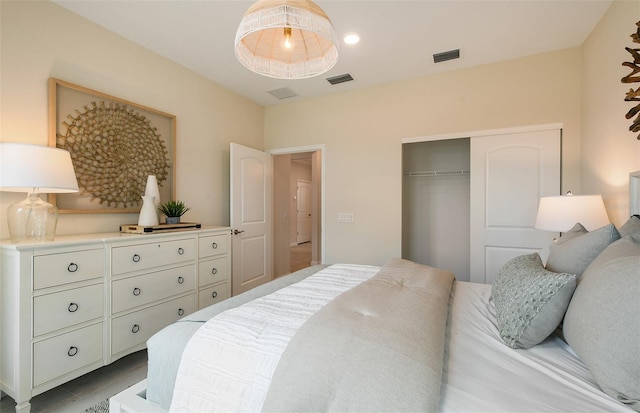 bedroom featuring a closet and visible vents