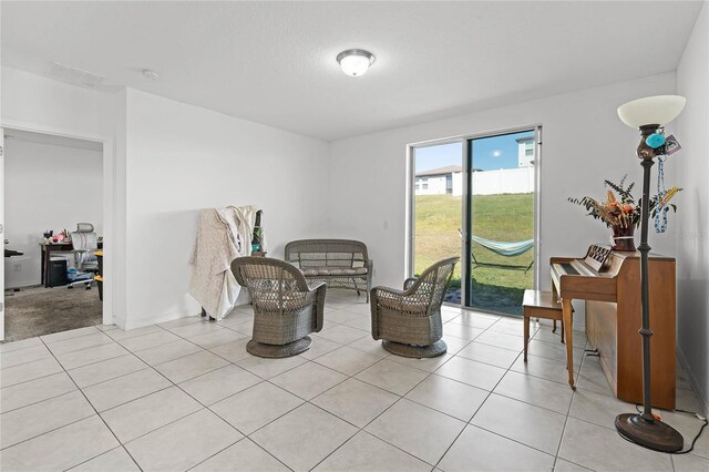 living area featuring light tile patterned floors