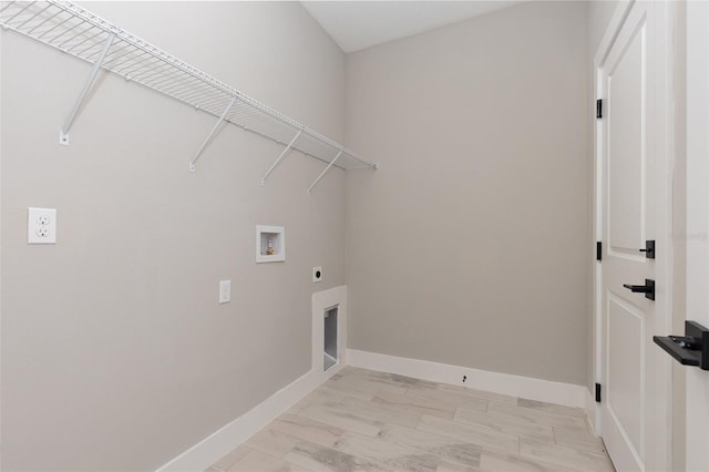 laundry area with washer hookup, laundry area, hookup for an electric dryer, and baseboards