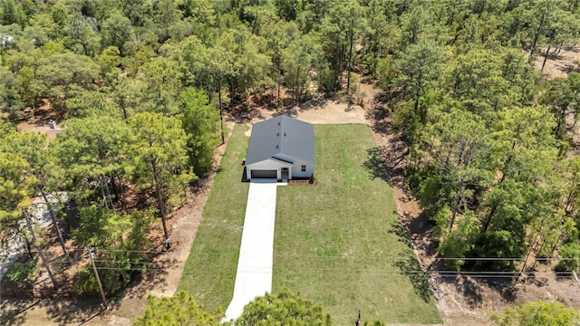 bird's eye view featuring a forest view