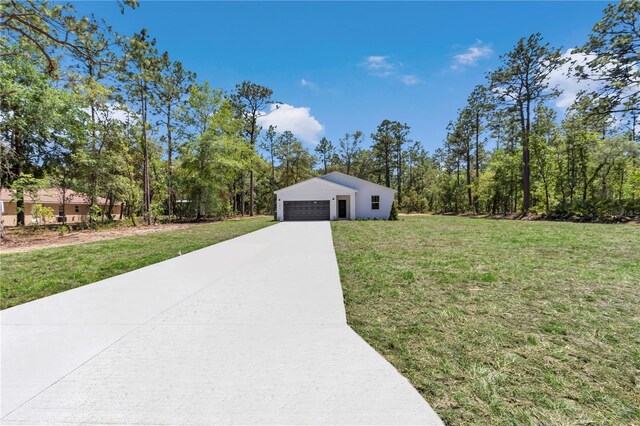 exterior space with a garage and a front yard