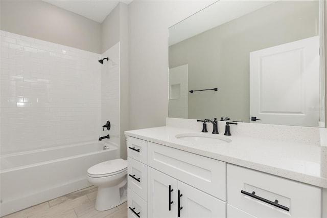 bathroom with toilet, bathing tub / shower combination, and vanity