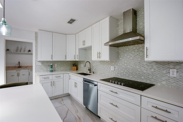 kitchen with black electric cooktop, a sink, marble finish floor, wall chimney range hood, and dishwasher