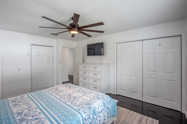 bedroom with ceiling fan and a closet