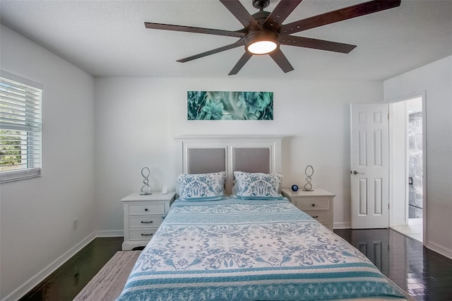 bedroom featuring ceiling fan, baseboards, and wood finished floors