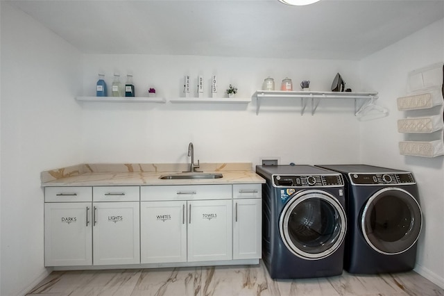 laundry room featuring cabinet space, a sink, marble finish floor, washing machine and dryer, and indoor wet bar