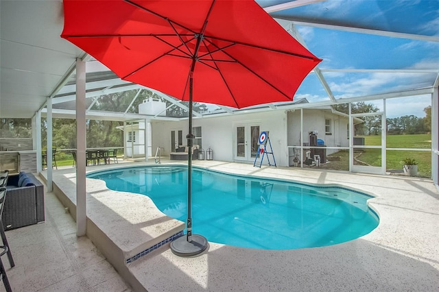 pool featuring a lanai and a patio