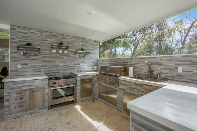 view of patio featuring exterior kitchen, a grill, and a sink