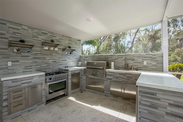 view of patio / terrace featuring a sink, grilling area, and exterior kitchen