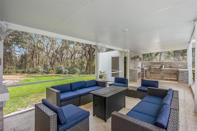 view of patio / terrace featuring an outdoor kitchen, a grill, outdoor lounge area, and a sink