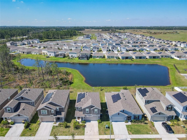 drone / aerial view featuring a water view and a residential view