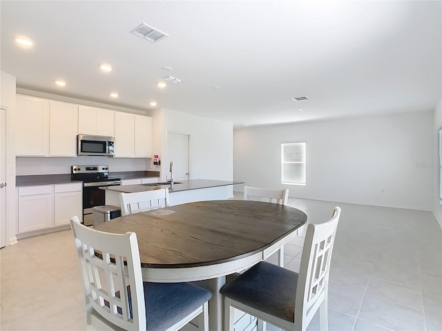 dining area with recessed lighting and visible vents