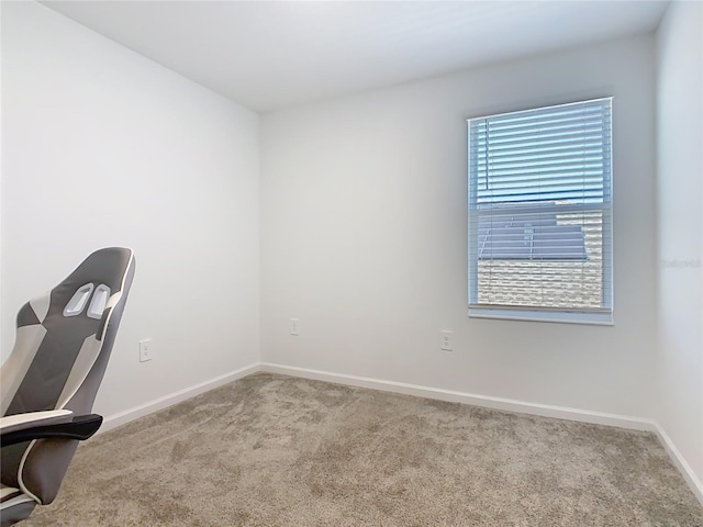 unfurnished office with carpet and baseboards